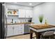 Modern kitchen featuring white cabinets, butcher block countertops, and stainless steel appliances at 3227 Stonehaven Dr, North Charleston, SC 29420