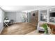 Bright room featuring vinyl flooring and charming brick details at 3227 Stonehaven Dr, North Charleston, SC 29420