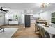 Open-concept living and dining space featuring hardwood floors, lots of light, and modern decor at 3227 Stonehaven Dr, North Charleston, SC 29420