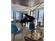 Bright living room featuring a grand piano and water views at 330 Concord St # 12 F&G, Charleston, SC 29401