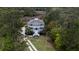 A picturesque aerial view of a two-story traditional home surrounded by lush greenery at 3547 Holmgren St, Mount Pleasant, SC 29466