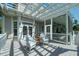 Charming back porch with rocking chairs, perfect for relaxing and enjoying the outdoors at 3547 Holmgren St, Mount Pleasant, SC 29466