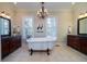 Elegant bathroom with a freestanding tub, classic fixtures, and dual vanities at 3547 Holmgren St, Mount Pleasant, SC 29466