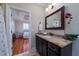 Bathroom with a granite countertop, dark cabinets, and an orchid decoration at 3547 Holmgren St, Mount Pleasant, SC 29466