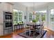 Inviting dining space with scenic views, hardwood floors, and a modern oven appliance at 3547 Holmgren St, Mount Pleasant, SC 29466