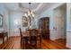 Formal dining room with hardwood floors, large windows, and elegant chandelier at 3547 Holmgren St, Mount Pleasant, SC 29466