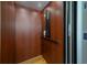 A residential elevator featuring a sleek design with wood paneling at 3547 Holmgren St, Mount Pleasant, SC 29466