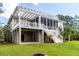The back exterior shows a lawn, patio with pergola, porch, balconies, and stairs at 3547 Holmgren St, Mount Pleasant, SC 29466
