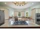Gourmet kitchen featuring granite countertops, stainless steel appliances, and a gas cooktop island at 3547 Holmgren St, Mount Pleasant, SC 29466