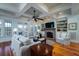 Well-lit living room features hardwood floors and a fireplace at 3547 Holmgren St, Mount Pleasant, SC 29466