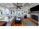 A sunlit living room featuring hardwood floors and a ceiling fan at 3547 Holmgren St, Mount Pleasant, SC 29466