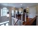 Loft area with hardwood floors, a fireplace, and a hanging decorative light fixture at 3547 Holmgren St, Mount Pleasant, SC 29466