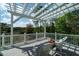Charming outdoor patio with comfortable seating, pergola and a serene wooded backdrop for relaxation at 3547 Holmgren St, Mount Pleasant, SC 29466