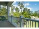 Balcony with a white railing overlooking lush greenery and the surrounding neighborhood at 3547 Holmgren St, Mount Pleasant, SC 29466