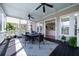 Spacious screened porch with ample seating and a view into the home, perfect for entertaining at 3547 Holmgren St, Mount Pleasant, SC 29466