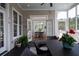 Inviting screened in porch with open view to a beautiful formal dining space at 3547 Holmgren St, Mount Pleasant, SC 29466