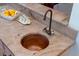 Close-up of a unique copper sink with a vintage faucet and beautiful granite countertop detail at 3547 Holmgren St, Mount Pleasant, SC 29466