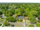 Aerial view of the home nestled among lush, mature trees in a quiet neighborhood at 405 Cross St, Charleston, SC 29407
