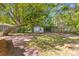 Large backyard featuring mature trees and a charming tree swing, perfect for relaxation at 405 Cross St, Charleston, SC 29407