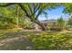 Expansive backyard featuring mature trees providing shade and character to the property at 405 Cross St, Charleston, SC 29407