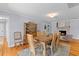 Elegant dining room with a large wooden table, a brick fireplace, and ample seating at 405 Cross St, Charleston, SC 29407