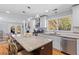 Open concept kitchen features a large island with bar seating and stainless steel appliances at 405 Cross St, Charleston, SC 29407