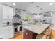 Modern kitchen with stainless steel appliances, granite countertops and custom cabinetry at 405 Cross St, Charleston, SC 29407