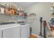 Functional laundry room with modern washer and dryer, wire shelving for optimal organization at 405 Cross St, Charleston, SC 29407