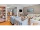 Open-concept living space with hardwood floors, comfortable seating, and stylish furnishings at 405 Cross St, Charleston, SC 29407