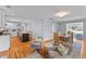 Bright, open living space features hardwood floors, a gourmet kitchen, and a dining area with natural light at 405 Cross St, Charleston, SC 29407