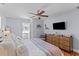 Bright main bedroom boasts hardwood floors, ample storage, and an ensuite bathroom at 405 Cross St, Charleston, SC 29407