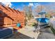 Fully fenced backyard with boat and trailer beside a covered entertainment space at 406 King Charles Cir, Summerville, SC 29485