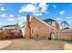 Spacious backyard with deck, mature trees, and storage shed at 406 King Charles Cir, Summerville, SC 29485