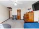 Spacious bedroom featuring neutral carpet flooring, a ceiling fan, and a full bed at 406 King Charles Cir, Summerville, SC 29485