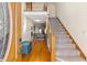Inviting foyer with hardwood floors, staircase, and a glimpse into the living area, offering a warm welcome at 406 King Charles Cir, Summerville, SC 29485