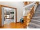 Inviting foyer featuring hardwood floors, staircase, and open doorway to another room at 406 King Charles Cir, Summerville, SC 29485