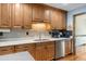 Eat-in kitchen boasting stainless steel appliances and ample wood cabinetry at 406 King Charles Cir, Summerville, SC 29485