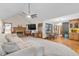 Bright living room featuring a fireplace, vaulted ceiling, and a ceiling fan at 406 King Charles Cir, Summerville, SC 29485