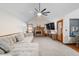 Well-lit living room with a ceiling fan and a traditional brick fireplace at 406 King Charles Cir, Summerville, SC 29485