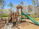 Community playground features a slide, tree-themed stairs and picnic seating nearby at 406 King Charles Cir, Summerville, SC 29485