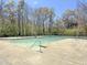 Large community pool features stairs, lane lines, and safety ladders on a sunny day at 406 King Charles Cir, Summerville, SC 29485