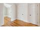 View of attic with hardwood floors and white doors at 41 Jane Jacobs St, Mount Pleasant, SC 29464
