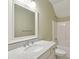 Bathroom with marble countertop vanity, decorative mirror, and a shower-tub combination at 41 Jane Jacobs St, Mount Pleasant, SC 29464