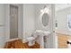 Bathroom features tile flooring, shower with glass door and white pedestal sink at 41 Jane Jacobs St, Mount Pleasant, SC 29464