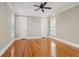 Neutral bedroom with hardwood floors, ceiling fan, and natural light from windows at 41 Jane Jacobs St, Mount Pleasant, SC 29464