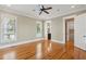Bright bedroom features hardwood floors, with ensuite bathroom and laundry room entrances at 41 Jane Jacobs St, Mount Pleasant, SC 29464