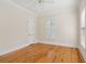 Light-filled bedroom features hardwood flooring, white trim, and ample natural light from the windows at 41 Jane Jacobs St, Mount Pleasant, SC 29464