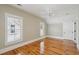 Bedroom featuring hardwood floors, white trim, neutral walls, natural light, and a ceiling fan at 41 Jane Jacobs St, Mount Pleasant, SC 29464
