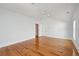 Bright bedroom featuring hardwood floors, white trim, blue walls, and natural light from multiple windows at 41 Jane Jacobs St, Mount Pleasant, SC 29464