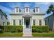 Charming two-story home with a well-manicured lawn and beautiful landscaping at 41 Jane Jacobs St, Mount Pleasant, SC 29464